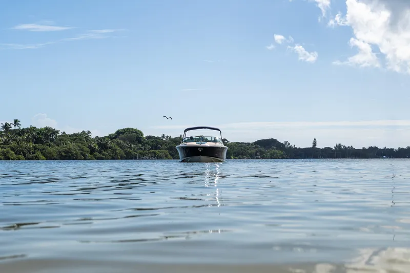 Slide: The Image of 2017 Chris-Craft Corsair 28 Heritage Edition on calm water, scenic background. - 95