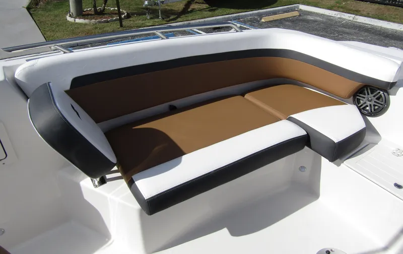 Slide: The Image of 2024 Starcraft SVX 191 OB CC boat seating area with brown and white upholstery. - 10