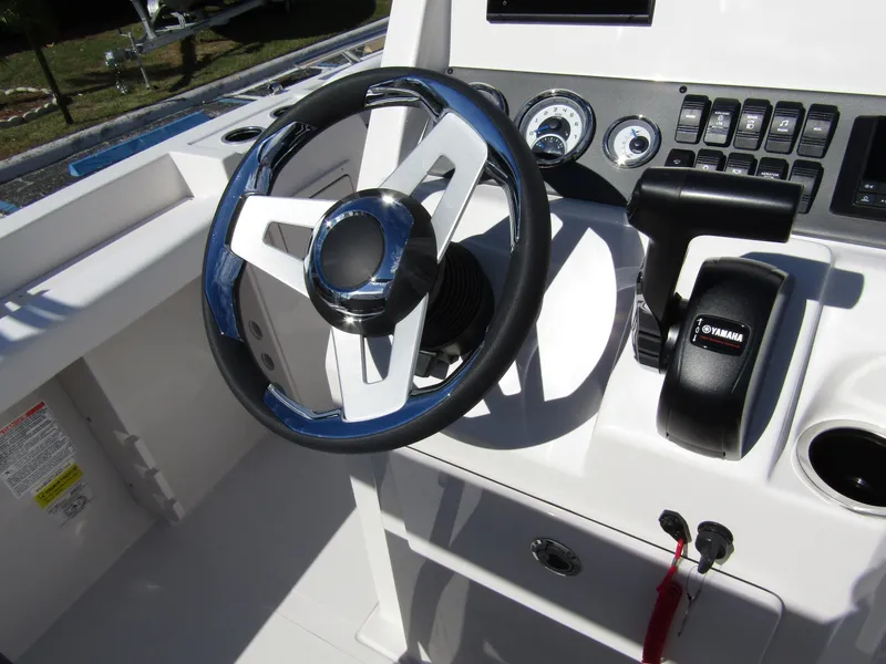 Slide: The Image of 2024 Starcraft SVX 191 OB CC boat steering wheel and control panel. - 27