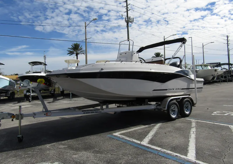 Slide: The Image of 2024 Starcraft SVX 191 OB CC boat on a trailer in a parking lot. - 6
