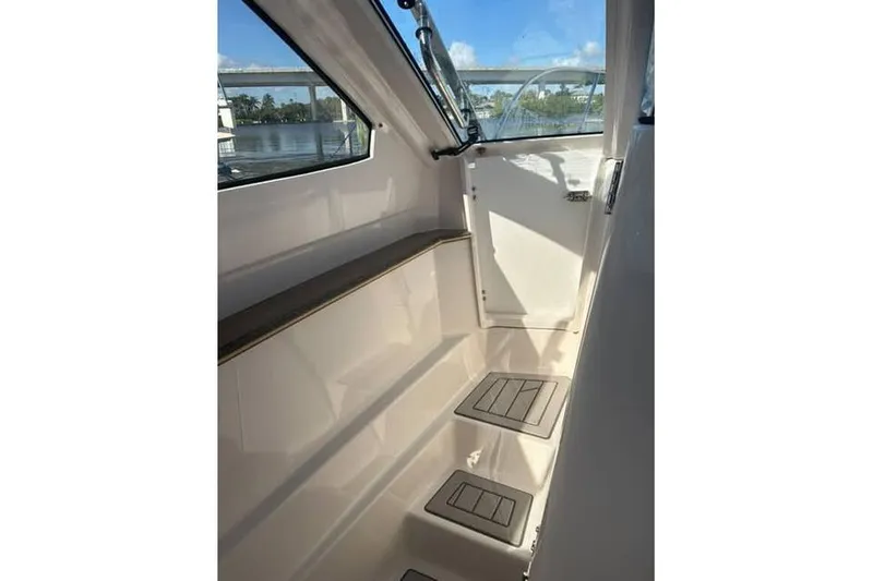 Slide: The Image of Interior view of 2026 Solara S-310 SB boat, featuring sleek design and modern finishes. - 13