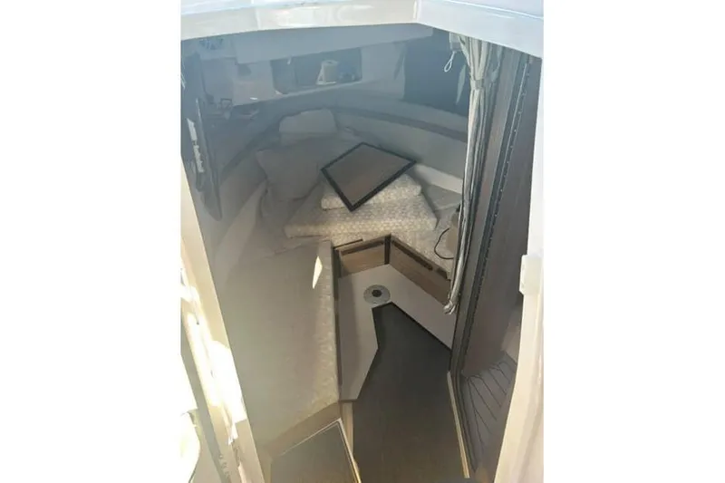 Slide: The Image of Interior cabin of 2026 Solara S-310 SB boat, featuring cozy seating and modern design. - 9
