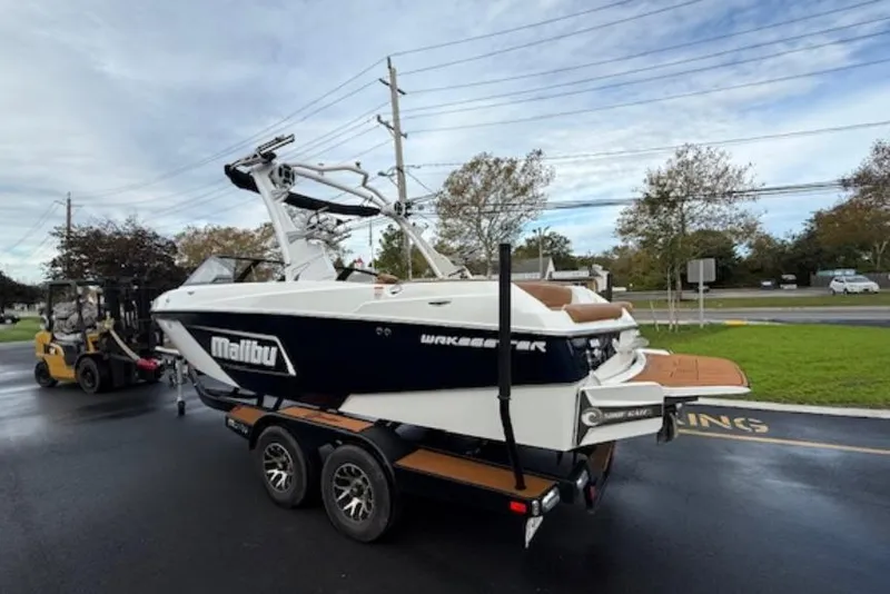 Slide: The Image of 2021 Malibu Wakesetter 22 LSV on trailer, parked outdoors on a cloudy day. - 3