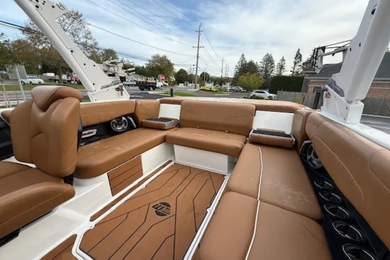 Slide: The Image of 2021 Malibu Wakesetter 22 LSV interior with tan leather seating and modern design. - 9