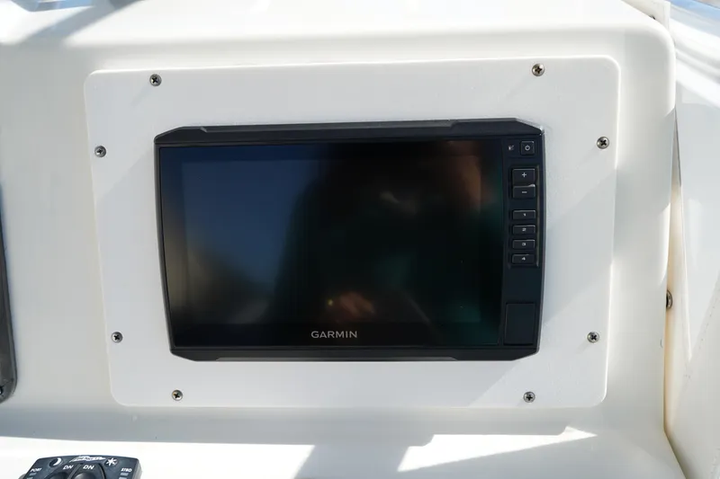 Slide: The Image of Garmin display on 2002 Fish Hawk 230 CC boat dashboard. - 19