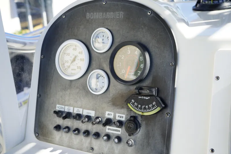 Slide: The Image of Dashboard of a 2002 Fish Hawk 230 CC boat with gauges and controls. - 21
