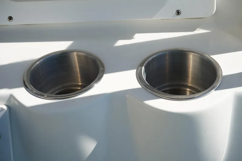 Slide: The Image of Stainless steel cup holders on 2002 Fish Hawk 230 CC boat. - 23