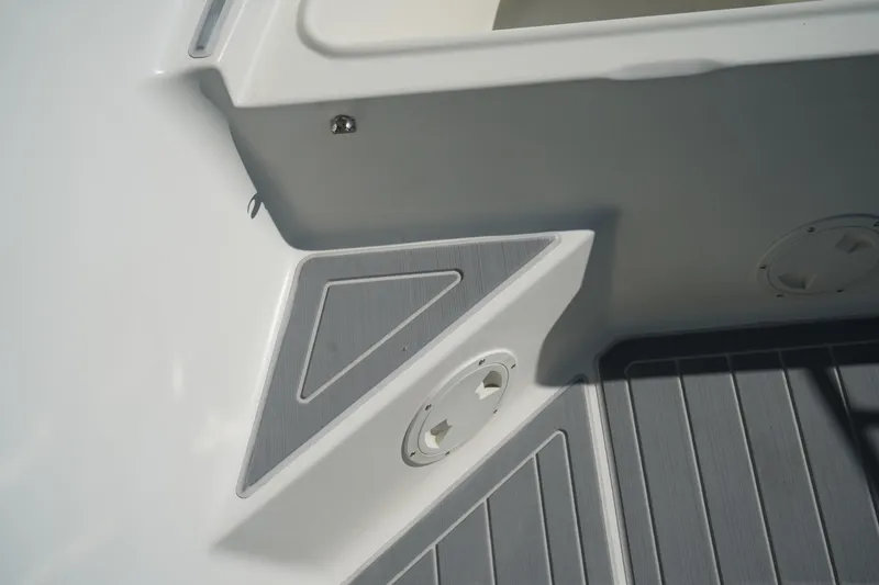 Slide: The Image of Close-up of 2002 Fish Hawk 230 CC boat interior with gray non-slip flooring. - 31