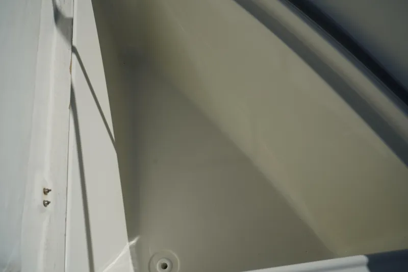 Slide: The Image of Interior view of a 2002 Fish Hawk 230 CC boat compartment. - 33