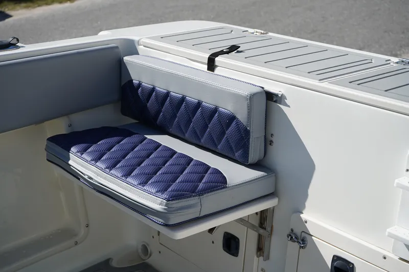 Slide: The Image of Blue and gray cushioned seat on 2002 Fish Hawk 230 CC boat. - 7
