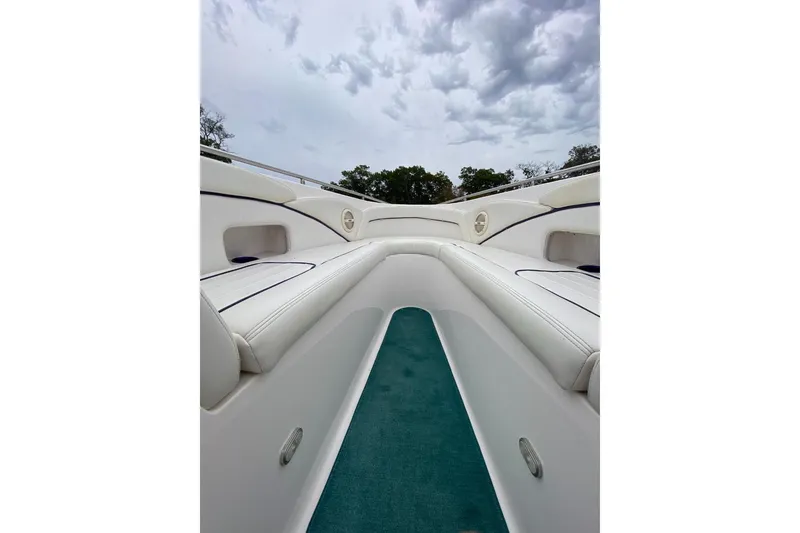 Slide: The Image of 2004 Envision 2900 Combo boat interior with white seating and green carpet. - 14