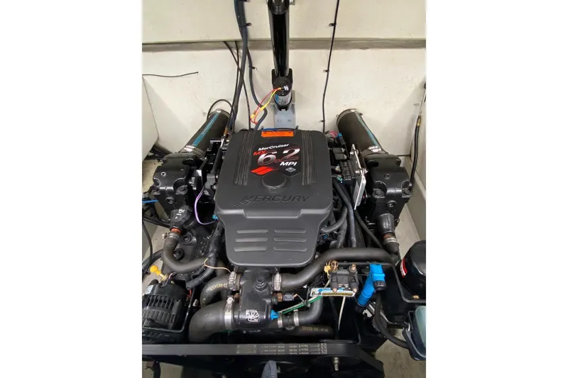 Slide: The Image of Engine of a 2004 Envision 2900 Combo boat, featuring a Mercury 6.2 MPI motor. - 16