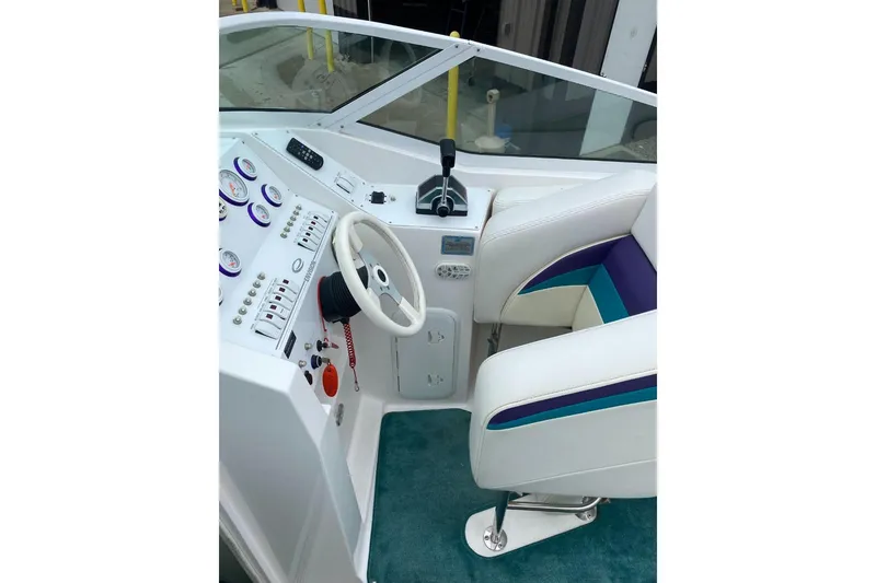 Slide: The Image of 2004 Envision 2900 Combo boat cockpit with steering wheel and control panel. - 8