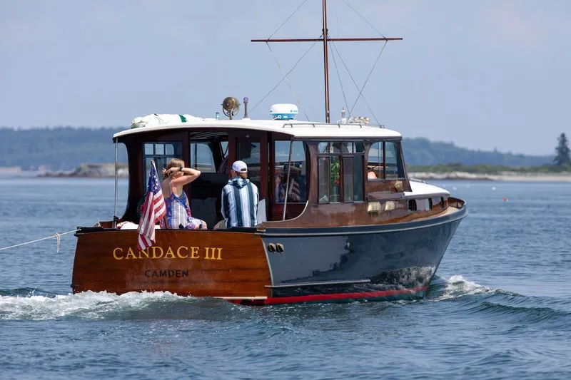 The Image of 1940 Elco Cruisette boat "Candace III" on water, featuring classic wooden design. - 0