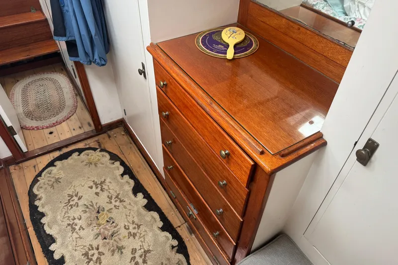 Slide: The Image of 1940 Elco Cruisette interior with wooden dresser and vintage decor. - 17