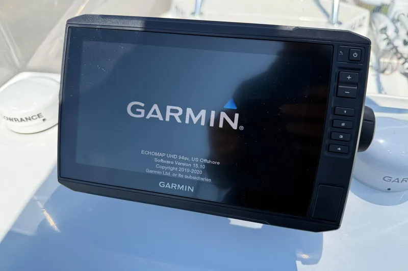Slide: The Image of Garmin ECHOMAP UHD 94sv on 2010 Shallow Sport 15 Classic boat dashboard. - 15