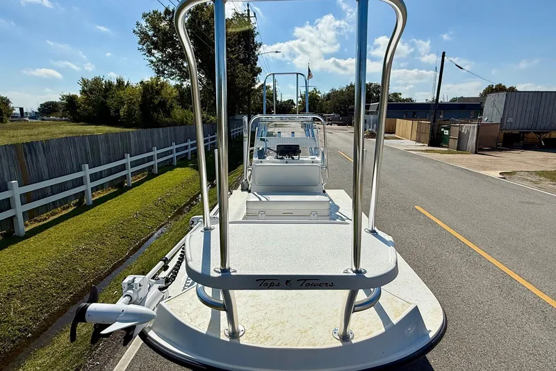 Slide: The Image of 2010 Shallow Sport 15 Classic boat on a road, featuring a raised platform. - 6