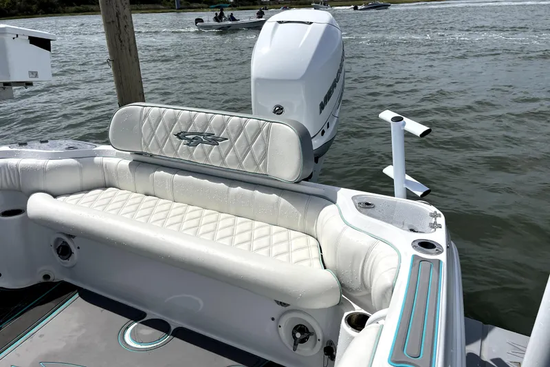 Slide: The Image of 2021 Glasstream 255 Pro-XS boat with white seating and Mercury outboard motor. - 12