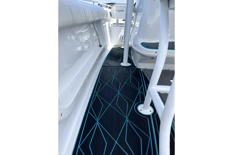 Slide: The Image of 2021 Glasstream 255 Pro-XS boat interior with sleek geometric flooring design. - 13