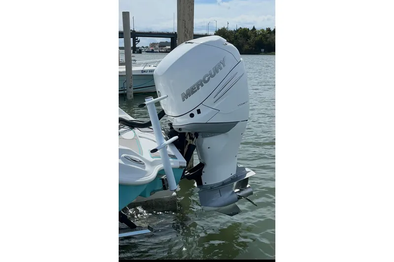 Slide: The Image of 2021 Glasstream 255 Pro-XS with Mercury outboard engine on water. - 16
