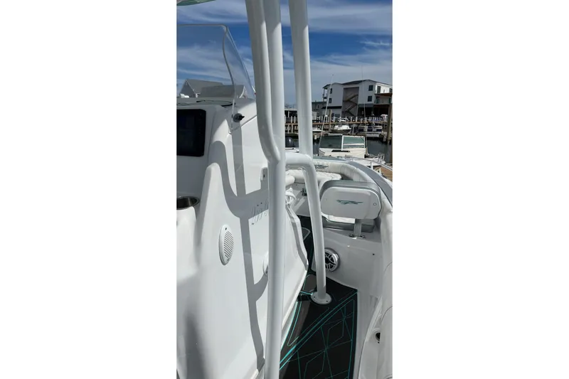 Slide: The Image of 2021 Glasstream 255 Pro-XS boat interior with modern design and marina view. - 17