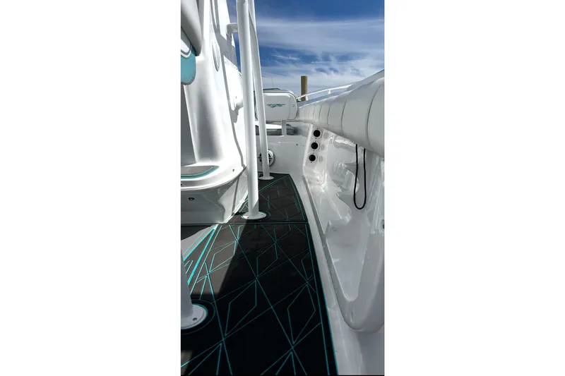 Slide: The Image of 2021 Glasstream 255 Pro-XS boat interior with sleek design and geometric flooring. - 19