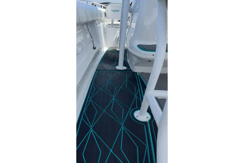 Slide: The Image of 2021 Glasstream 255 Pro-XS boat interior with stylish geometric flooring design. - 24
