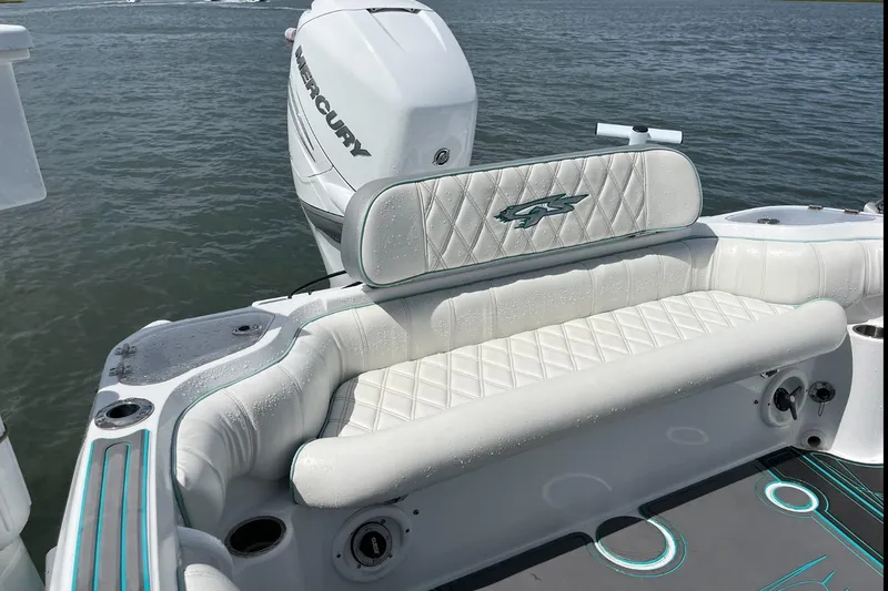 Slide: The Image of 2021 Glasstream 255 Pro-XS boat with Mercury engine, featuring white cushioned seating. - 26