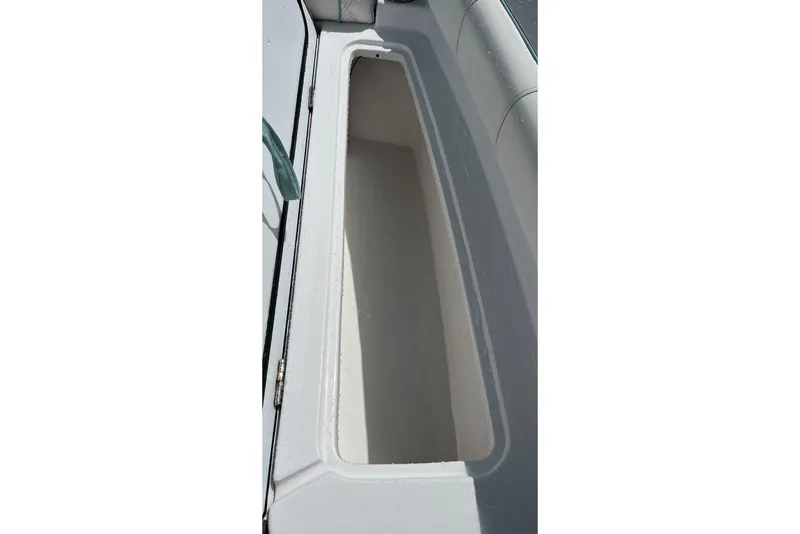 Slide: The Image of 2021 Glasstream 255 Pro-XS boat storage compartment, open and empty. - 31