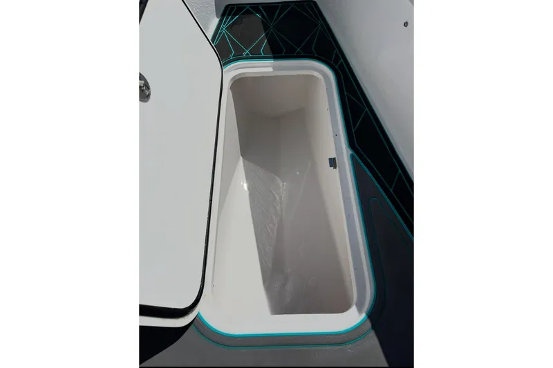 Slide: The Image of Open storage compartment on 2021 Glasstream 255 Pro-XS boat, featuring sleek interior design. - 32