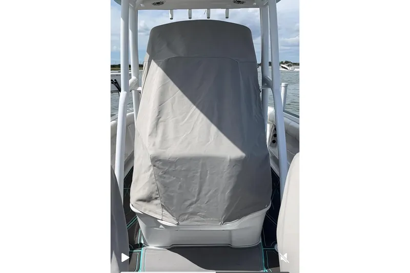 Slide: The Image of 2021 Glasstream 255 Pro-XS boat with covered console on water. - 8
