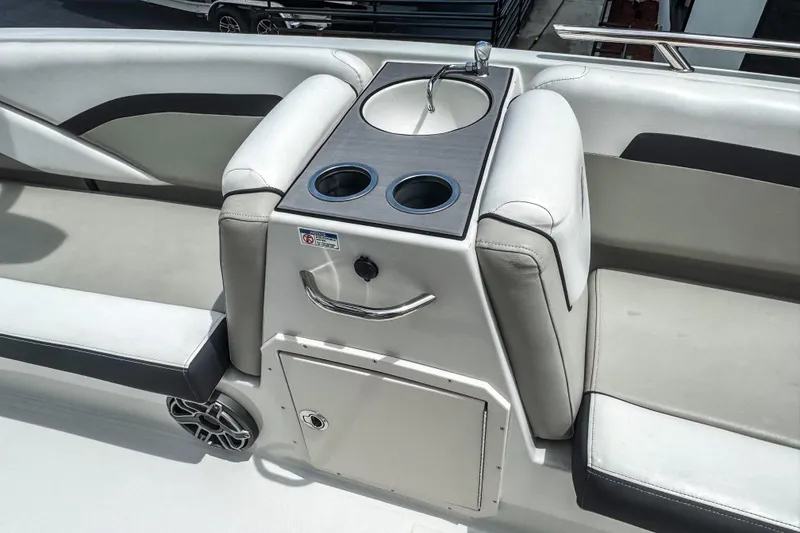 Slide: The Image of 2024 Starcraft SVX 211 OB boat interior with sink and cup holders. - 8