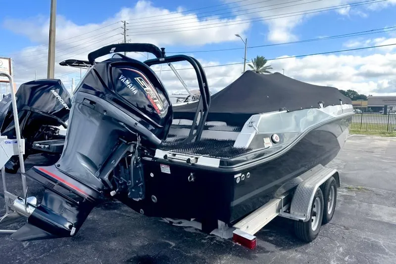 Slide: The Image of 2024 Starcraft SVX 211 OB boat with Yamaha outboard motor on a trailer. - 1