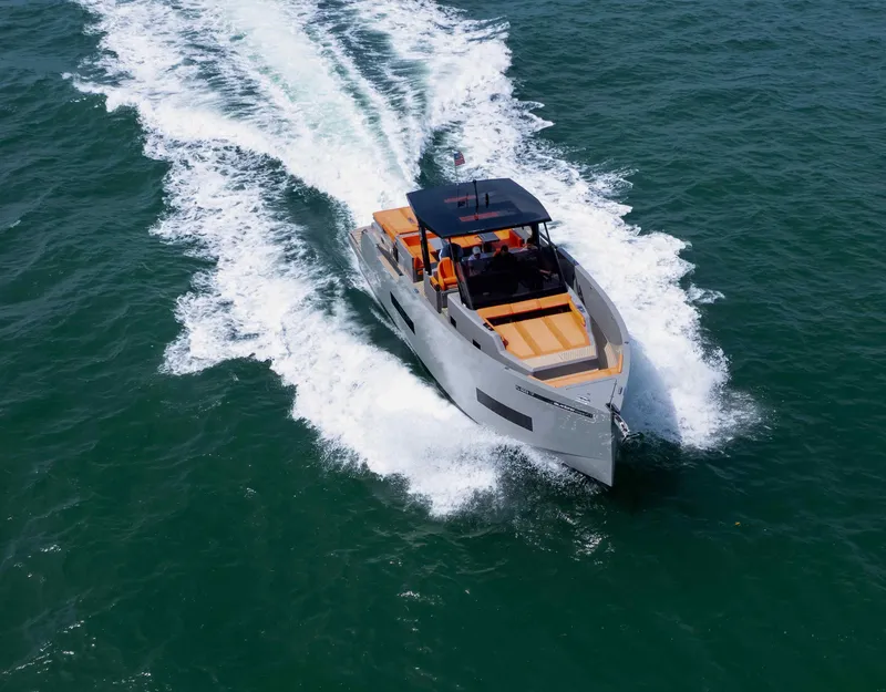 Slide: The Image of 2023 De Antonio Yachts D50 cruising on open water, showcasing sleek design and performance. - 13