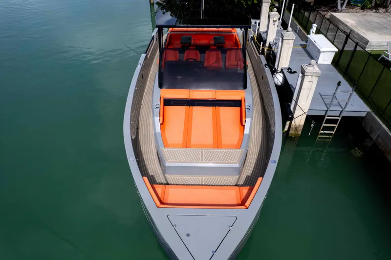 Slide: The Image of 2023 De Antonio Yachts D50 with sleek design and vibrant orange seating. - 23