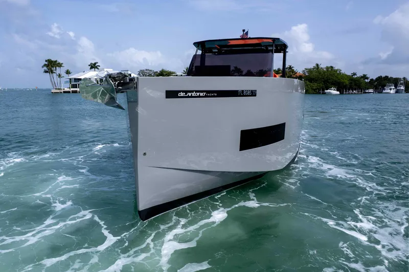 Slide: The Image of 2023 De Antonio Yachts D50 cruising on turquoise waters under a clear sky. - 26