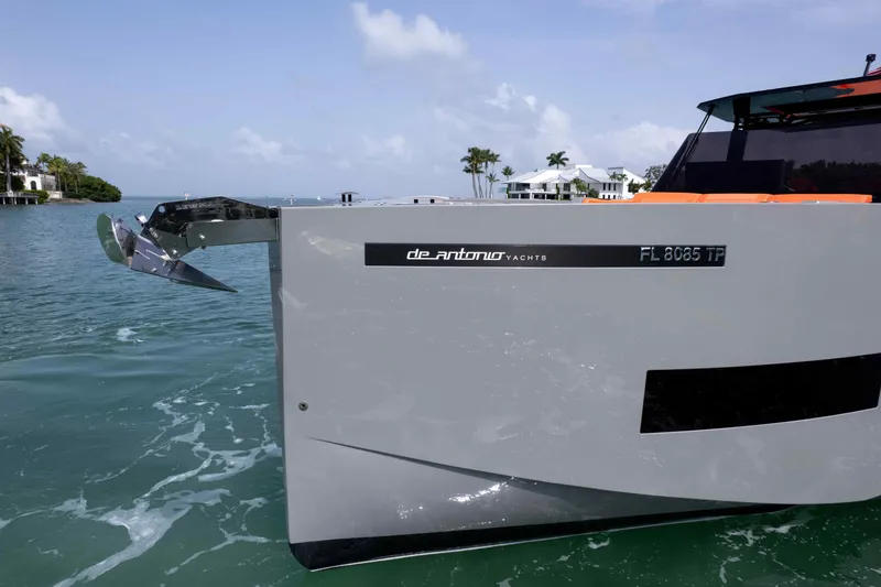 Slide: The Image of 2023 De Antonio Yachts D50, sleek design, anchored in calm waters, modern luxury yacht. - 27