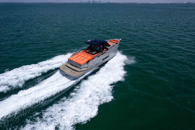 Slide: The Image of 2023 De Antonio Yachts D50 cruising on open water, showcasing sleek design and performance. - 32