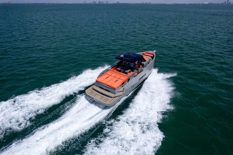 Slide: The Image of 2023 De Antonio Yachts D50 cruising on open water, showcasing sleek design and performance. - 33