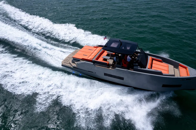 Slide: The Image of 2023 De Antonio Yachts D50 cruising on open water, showcasing sleek design and vibrant seating. - 35