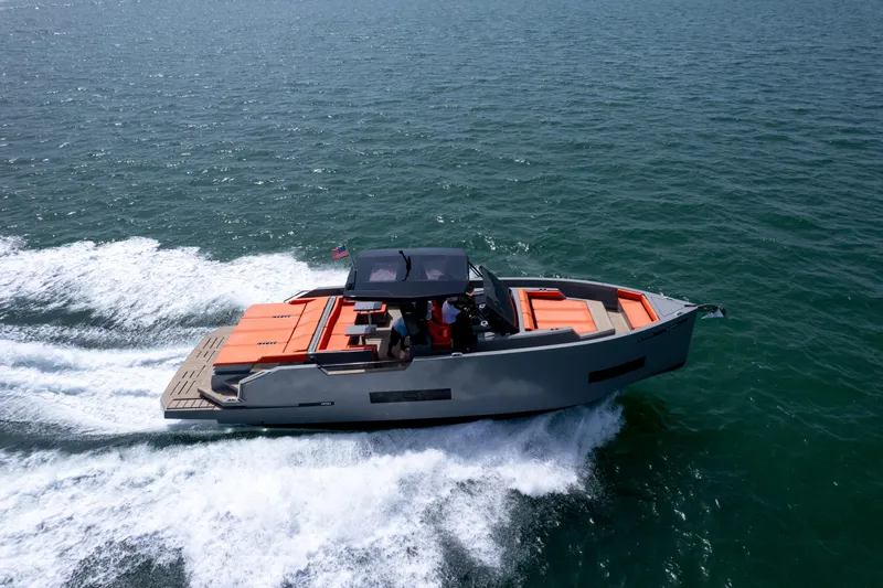 Slide: The Image of 2023 De Antonio Yachts D50 cruising on open water, showcasing sleek design and vibrant seating. - 36