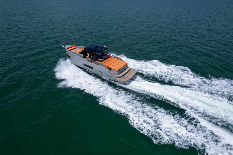 Slide: The Image of 2023 De Antonio Yachts D50 cruising on open water, showcasing sleek design and performance. - 38