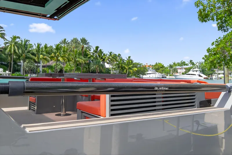 Slide: The Image of 2023 De Antonio Yachts D50 with sleek design, docked near tropical scenery. - 39