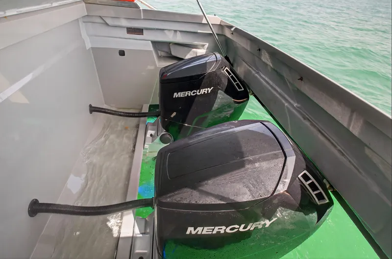 Slide: The Image of Twin Mercury outboard engines on 2023 De Antonio Yachts D50, cruising in clear waters. - 48