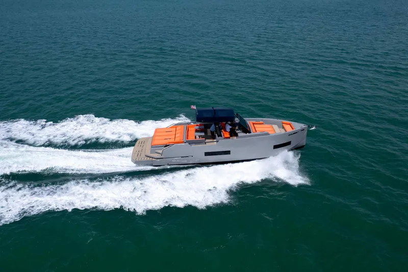 Slide: The Image of 2023 De Antonio Yachts D50 cruising on open water, showcasing sleek design and vibrant accents. - 9