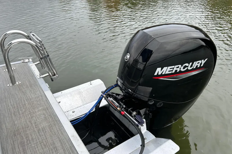 Slide: The Image of 2023 Bennington 22 SSR with Mercury outboard engine on water. - 17