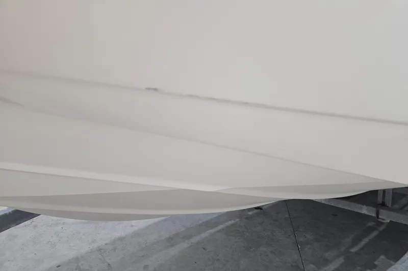 Slide: The Image of Close-up of 1999 Boston Whaler Dauntless 14 boat hull in a garage. - 23