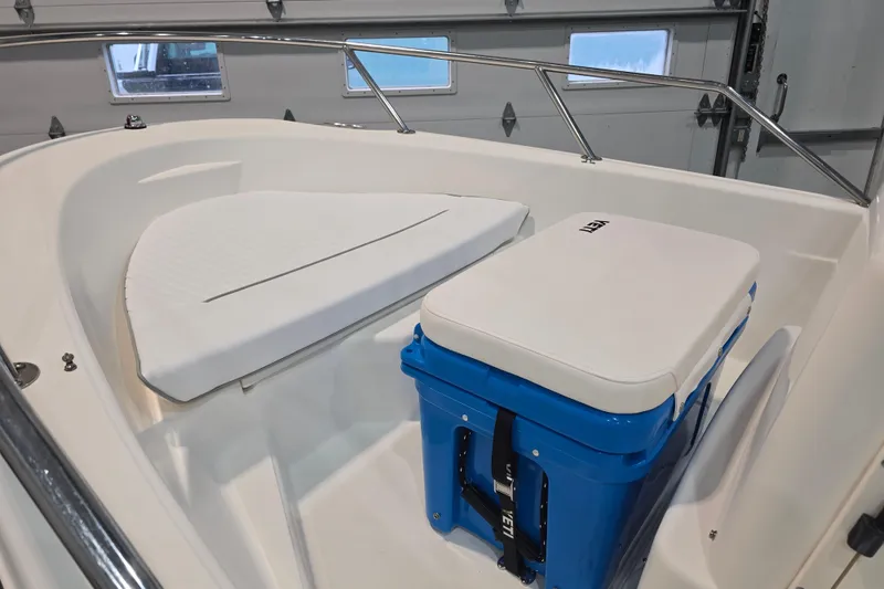 Slide: The Image of 1999 Boston Whaler Dauntless 14 boat interior with seating and a blue YETI cooler. - 31