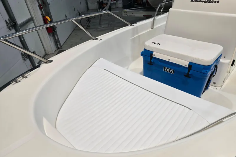 Slide: The Image of 1999 Boston Whaler Dauntless 14 boat interior with Yeti cooler and cushioned seating. - 35