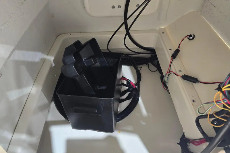 Slide: The Image of 1999 Boston Whaler Dauntless 14 interior wiring and battery compartment. - 36